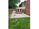 Expansive concrete patio in a backyard with a privacy fence, perfect for outdoor entertaining and relaxation at 6210 Douglas Manor Ct, Douglasville, GA 30134