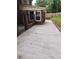Concrete patio area in backyard with decorative iron gate, perfect for relaxing or entertaining guests outdoors at 6210 Douglas Manor Ct, Douglasville, GA 30134
