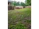 Spacious backyard features a wooden fence, offering privacy and a safe outdoor space at 6210 Douglas Manor Ct, Douglasville, GA 30134