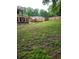 Large, mostly grass backyard featuring a wooden fence for privacy at 6210 Douglas Manor Ct, Douglasville, GA 30134