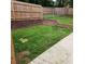 Fenced backyard with brick retaining wall and chain-link fence offers security at 6210 Douglas Manor Ct, Douglasville, GA 30134