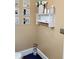 Bathroom corner featuring wall decor, vanity shelf, and a blue rug at 6210 Douglas Manor Ct, Douglasville, GA 30134