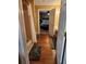 Bathroom leading into the bedroom with hardwood flooring and a view of the bed at 6210 Douglas Manor Ct, Douglasville, GA 30134