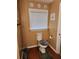 Bathroom showcasing neutral wall color, a standard toilet, and classic decor at 6210 Douglas Manor Ct, Douglasville, GA 30134