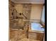 A walk in shower with accessibility bars next to a soaking tub with tile surround at 6210 Douglas Manor Ct, Douglasville, GA 30134