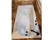 A white jetted bathtub with black fixtures and a tiled surround at 6210 Douglas Manor Ct, Douglasville, GA 30134
