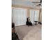 Bedroom featuring carpet, guitar and a ceiling fan at 6210 Douglas Manor Ct, Douglasville, GA 30134