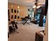 Bonus room featuring wall mirrors, gym equipment, and a ceiling fan at 6210 Douglas Manor Ct, Douglasville, GA 30134