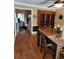 Dining room showcasing hardwood floors and a built-in wooden hutch at 6210 Douglas Manor Ct, Douglasville, GA 30134