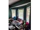 Workout room with natural light, modern equipment, and green accent walls at 6210 Douglas Manor Ct, Douglasville, GA 30134