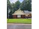 Charming brick home with a well-maintained front yard and mature trees at 6210 Douglas Manor Ct, Douglasville, GA 30134