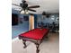 Inviting game room featuring a pool table, ceiling fan, and decorative wall art at 6210 Douglas Manor Ct, Douglasville, GA 30134
