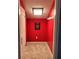 Hallway with red wall and decorative poster at 6210 Douglas Manor Ct, Douglasville, GA 30134