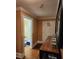 Hallway with hardwood floors, beige walls, and an open door to the bathroom at 6210 Douglas Manor Ct, Douglasville, GA 30134