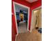 Hallway view leading to a game room, showcasing the home's layout and design at 6210 Douglas Manor Ct, Douglasville, GA 30134