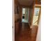 Hallway featuring hardwood floors, decor and entryways to other rooms at 6210 Douglas Manor Ct, Douglasville, GA 30134