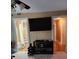 Hallway featuring access to the bathroom and room, and a large flat screen TV at 6210 Douglas Manor Ct, Douglasville, GA 30134