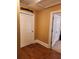 Hallway with hardwood floors leading to the gameroom at 6210 Douglas Manor Ct, Douglasville, GA 30134