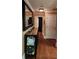 Hallway featuring wood floors, beige walls, and decorative trim at 6210 Douglas Manor Ct, Douglasville, GA 30134