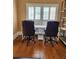 Bright home office with wood floors, shelving, and large window views for a productive workspace at 6210 Douglas Manor Ct, Douglasville, GA 30134