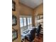 Cozy home office featuring a modern desk, shelving, and a window with plantation shutters at 6210 Douglas Manor Ct, Douglasville, GA 30134
