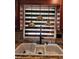A kitchen sink with modern fixtures, a stylish backsplash, and decorative lighting, blending functionality and design at 6210 Douglas Manor Ct, Douglasville, GA 30134