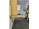Laundry room featuring an open ironing board, sink, and appliances at 6210 Douglas Manor Ct, Douglasville, GA 30134