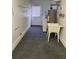 Laundry room with a sink, water heater, washing machine, and gray carpeting at 6210 Douglas Manor Ct, Douglasville, GA 30134