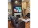 Living room featuring a fireplace, mantle, and hardwood floors at 6210 Douglas Manor Ct, Douglasville, GA 30134