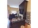 Elegant living room with high ceilings, fireplace, and comfortable seating, perfect for relaxing and entertaining guests at 6210 Douglas Manor Ct, Douglasville, GA 30134