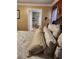 A bed with an ornate headboard is visible through the door into the primary bathroom at 6210 Douglas Manor Ct, Douglasville, GA 30134