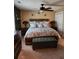 Comfortable main bedroom with a ceiling fan, elegant decor, and natural light at 6210 Douglas Manor Ct, Douglasville, GA 30134