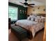 Spacious main bedroom features a large bed, accent wall, and relaxing decor at 6210 Douglas Manor Ct, Douglasville, GA 30134