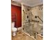 A large shower with multiple shower heads and accessibility grab bars at 6210 Douglas Manor Ct, Douglasville, GA 30134