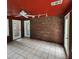 Sunroom featuring brick walls, tile floor, multiple windows, and access doors at 6210 Douglas Manor Ct, Douglasville, GA 30134