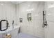 This bathroom has a marble tile shower, black hardware, a niche and a free standing tub at 862 Hobson Street Southwest Sw St, Atlanta, GA 30310