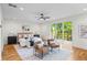 This primary bedroom features hardwood floors, a ceiling fan, a king bed and sliding doors to a deck at 862 Hobson Street Southwest Sw St, Atlanta, GA 30310