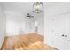 Bright bedroom features wood floors, modern lighting, and closet doors at 862 Hobson Street Southwest Sw St, Atlanta, GA 30310