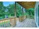 This wood deck is covered and features wood railings, wood beams and a set of stairs to the yard at 862 Hobson Street Southwest Sw St, Atlanta, GA 30310