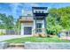 New construction home boasts a modern design with a second story balcony and a covered front porch at 862 Hobson Street Southwest Sw St, Atlanta, GA 30310