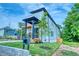 New construction home with a manicured lawn, front porch and a second story balcony at 862 Hobson Street Southwest Sw St, Atlanta, GA 30310