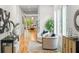 Hallway with hardwood floors, leading to a bright, open living space at 862 Hobson Street Southwest Sw St, Atlanta, GA 30310