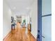 Long hallway with wood flooring and views of the living and dining areas at 862 Hobson Street Southwest Sw St, Atlanta, GA 30310