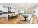 Open concept kitchen, dining, and living room space featuring modern decor and stainless steel appliances at 862 Hobson Street Southwest Sw St, Atlanta, GA 30310
