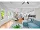 Bright, open living area connects to the kitchen and dining space, with hardwood flooring at 862 Hobson Street Southwest Sw St, Atlanta, GA 30310