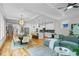 Spacious living area with hardwood floors, kitchen island, and dining space at 862 Hobson Street Southwest Sw St, Atlanta, GA 30310