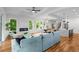 Open-concept living room with fireplace, dining area, island kitchen, and hardwood floors at 862 Hobson Street Southwest Sw St, Atlanta, GA 30310