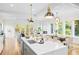 Bright living room with large windows, access to an outdoor deck, and a modern fireplace at 862 Hobson Street Southwest Sw St, Atlanta, GA 30310