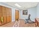 Finished basement area featuring wood-look flooring and abundant closet storage and natural light at 980 Casteel Rd, Powder Springs, GA 30127