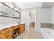 Bright bathroom with a spacious vanity, walk in access, and neutral color palette at 980 Casteel Rd, Powder Springs, GA 30127
